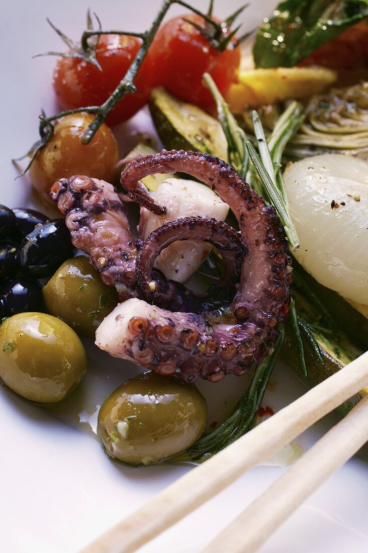 Antipasti platter of marinated vegetables and octopus
