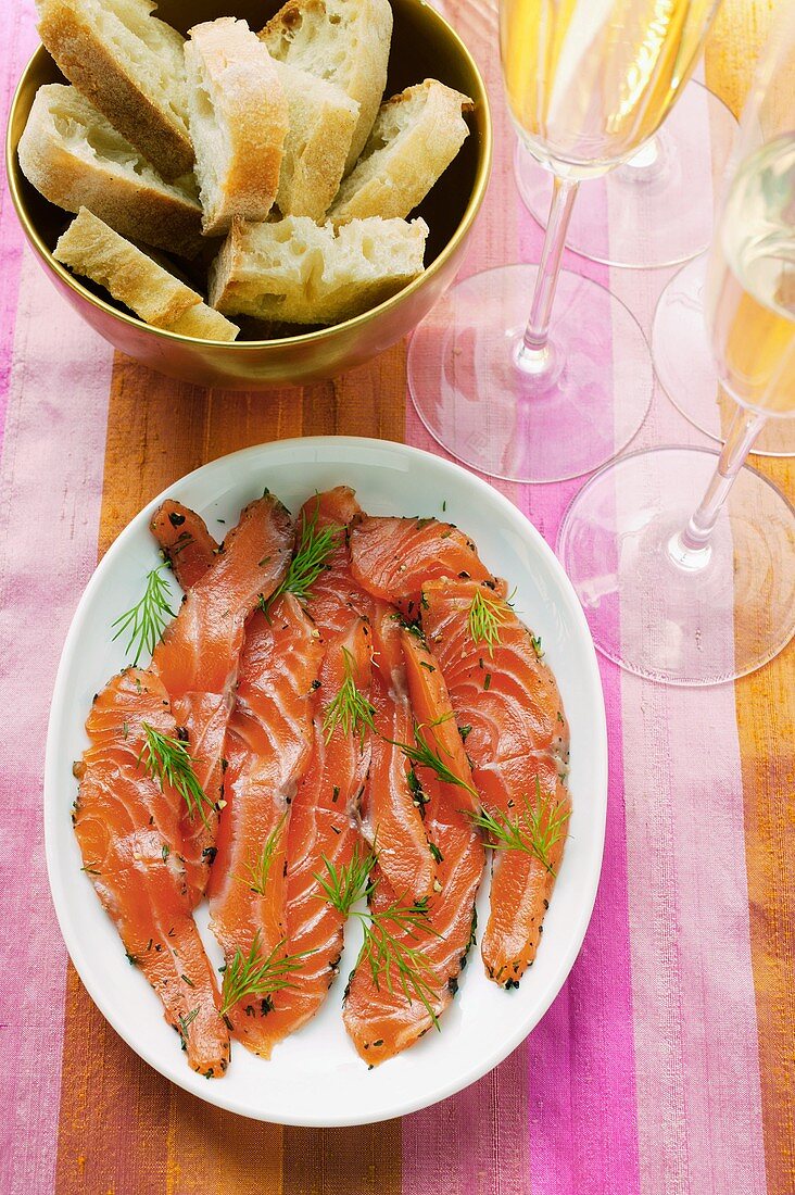 Graved lachs with dill; baguette; champagne
