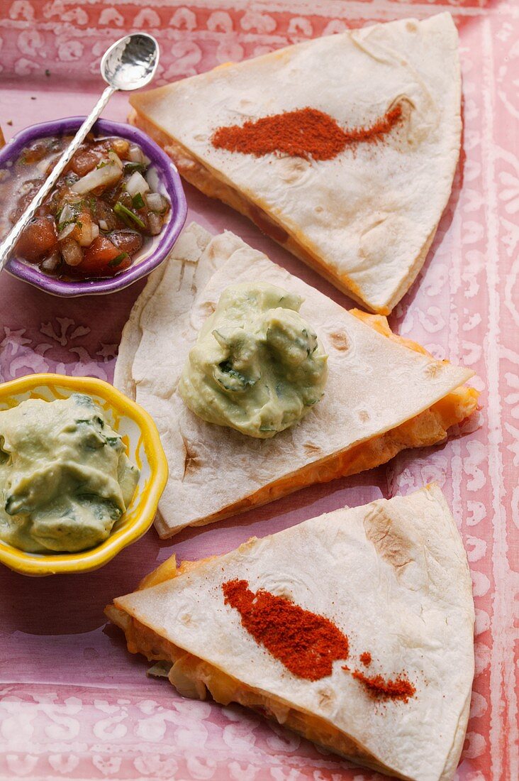 Shrimp enchiladas; guacamole; tomato salsa