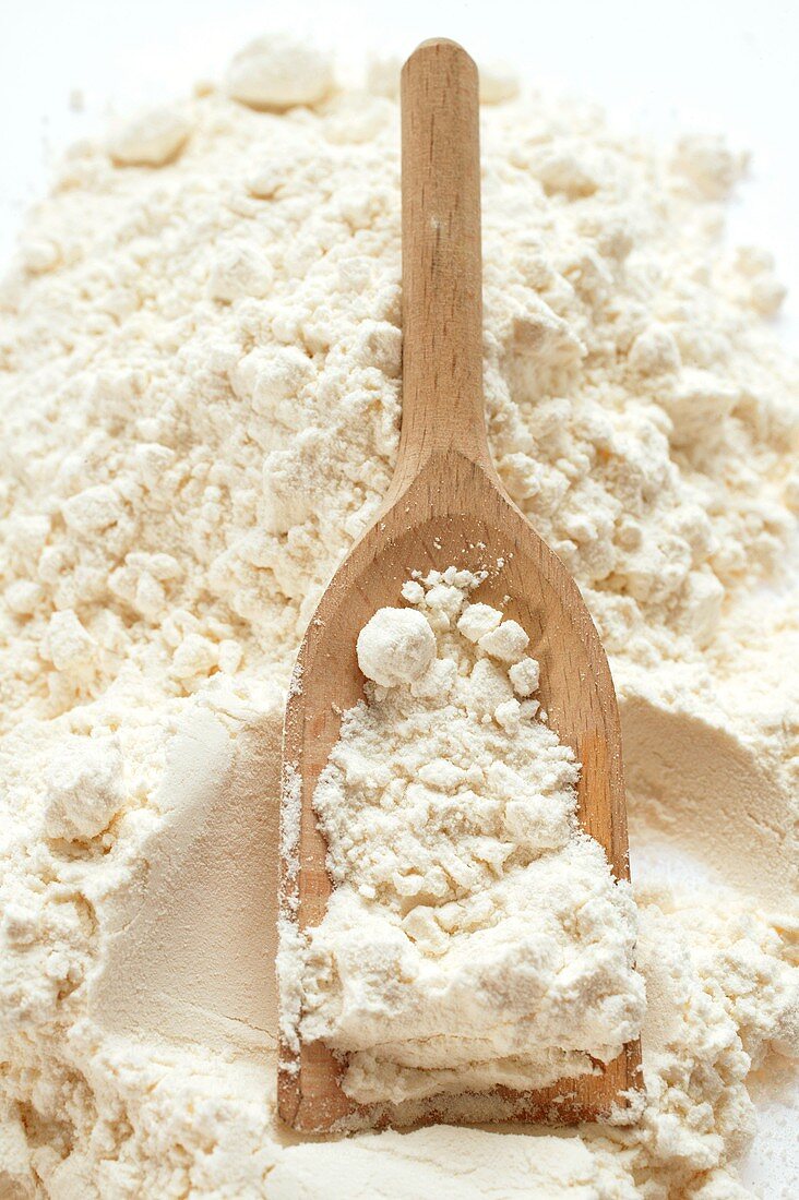 Flour with wooden scoop