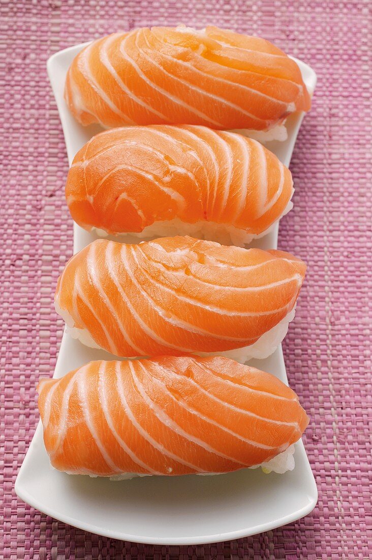 Four nigiri-sushi with salmon