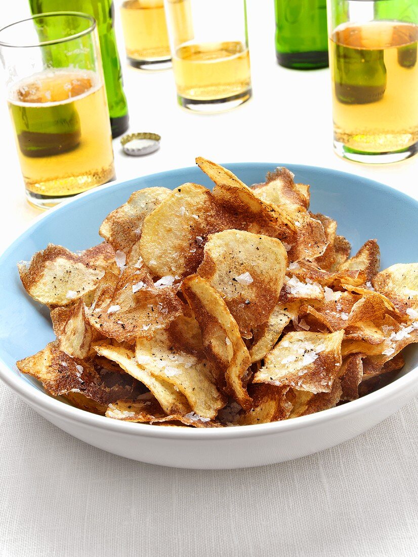 Home-made potato crisps; beer