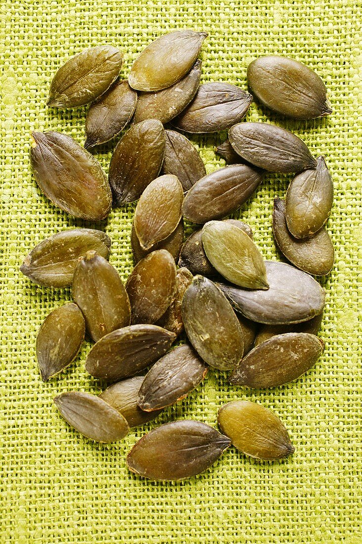 Pumpkin seeds on jute background