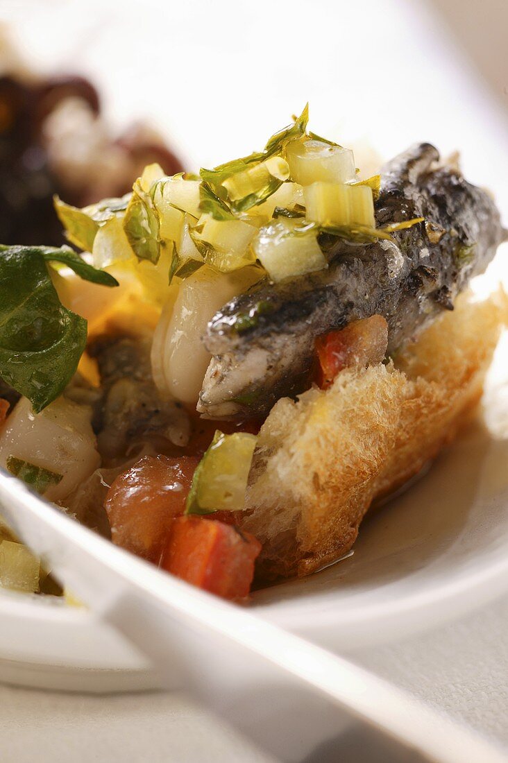 White bread with sardine, celery and peppers