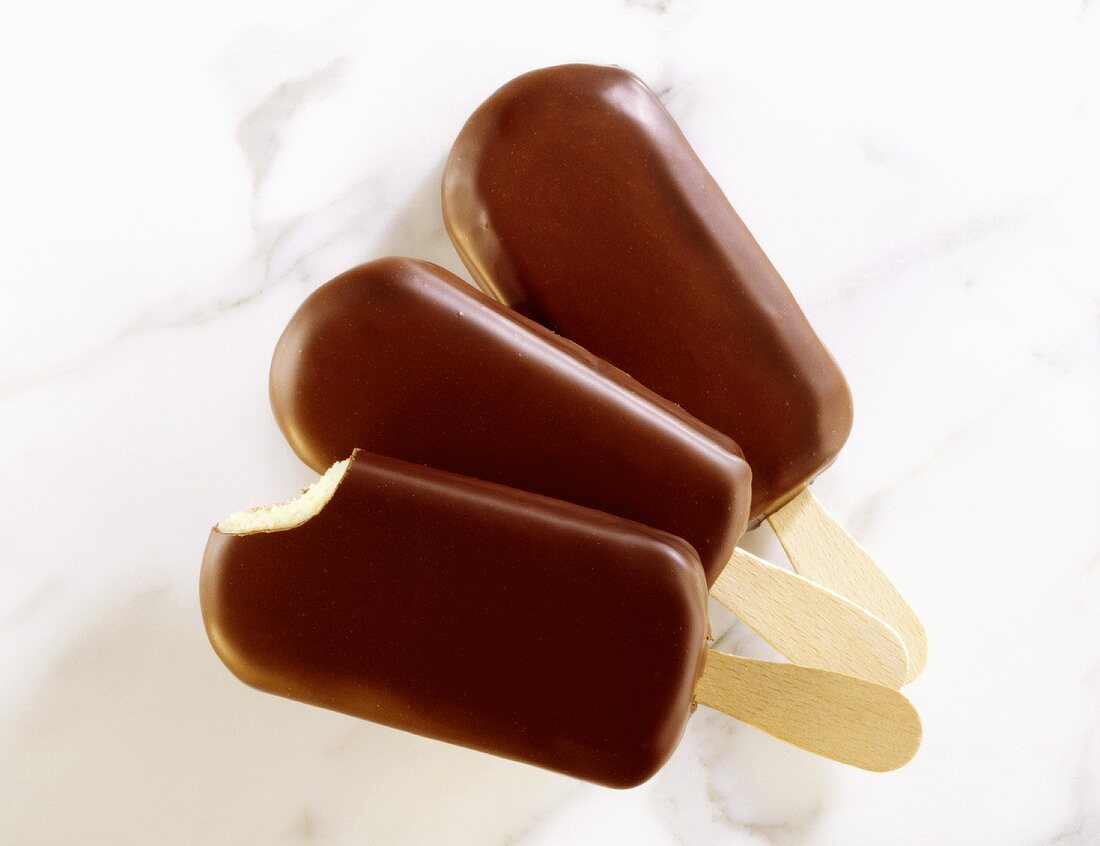 Chocolate-coated vanilla ice on stick