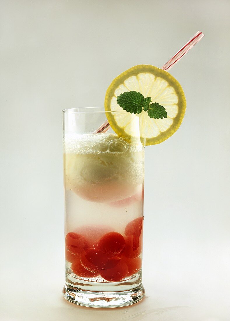 Drink with lemon ice cream and cocktail cherries