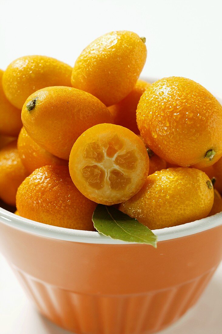 Kumquats in orange bowl