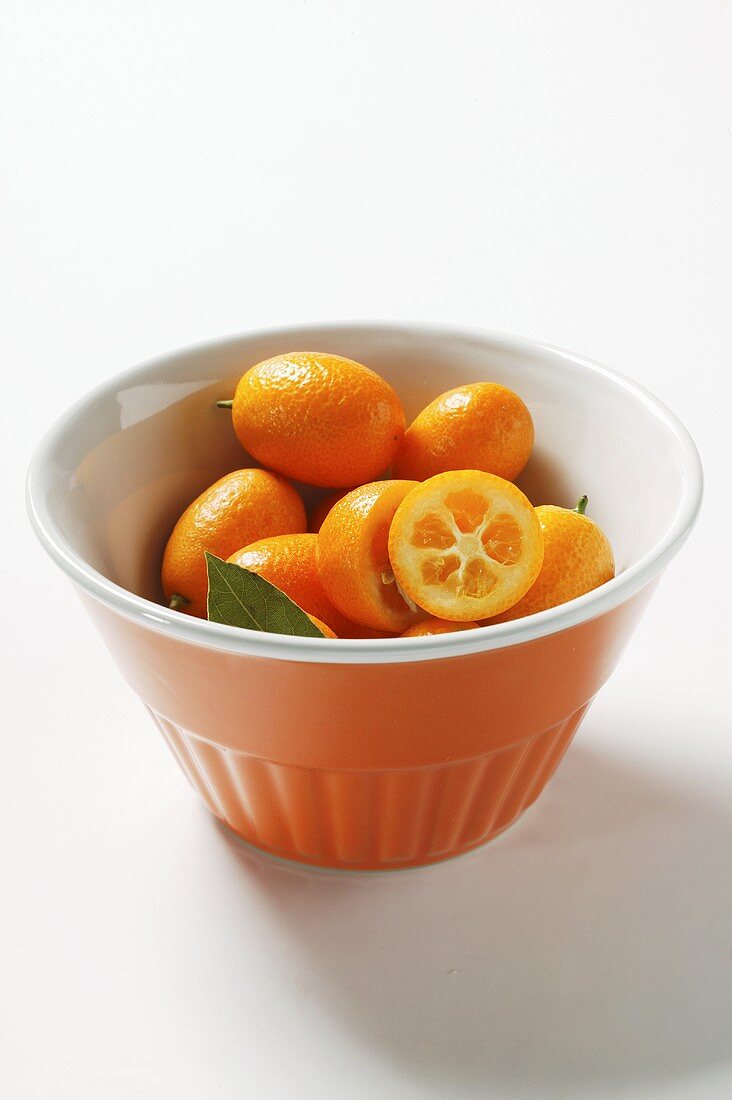 Kumquats in orange bowl