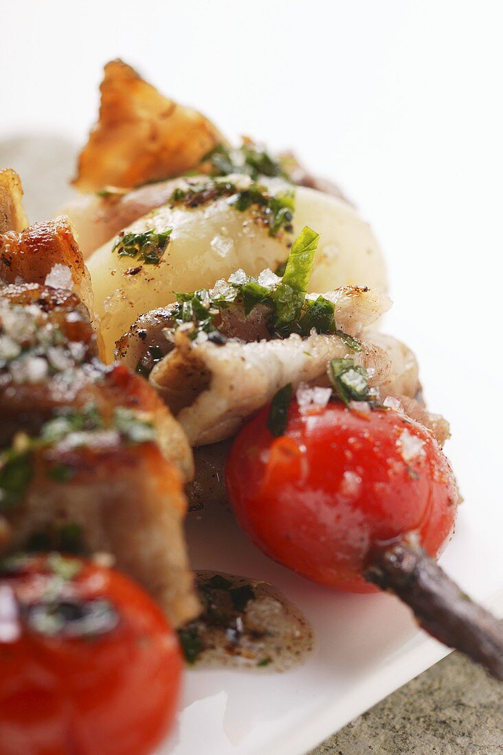 Barbecued pork kebabs with cherry tomatoes