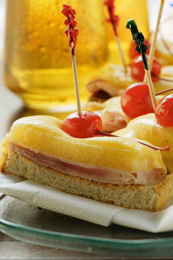 Ham and cheese on toast with cocktail cherries