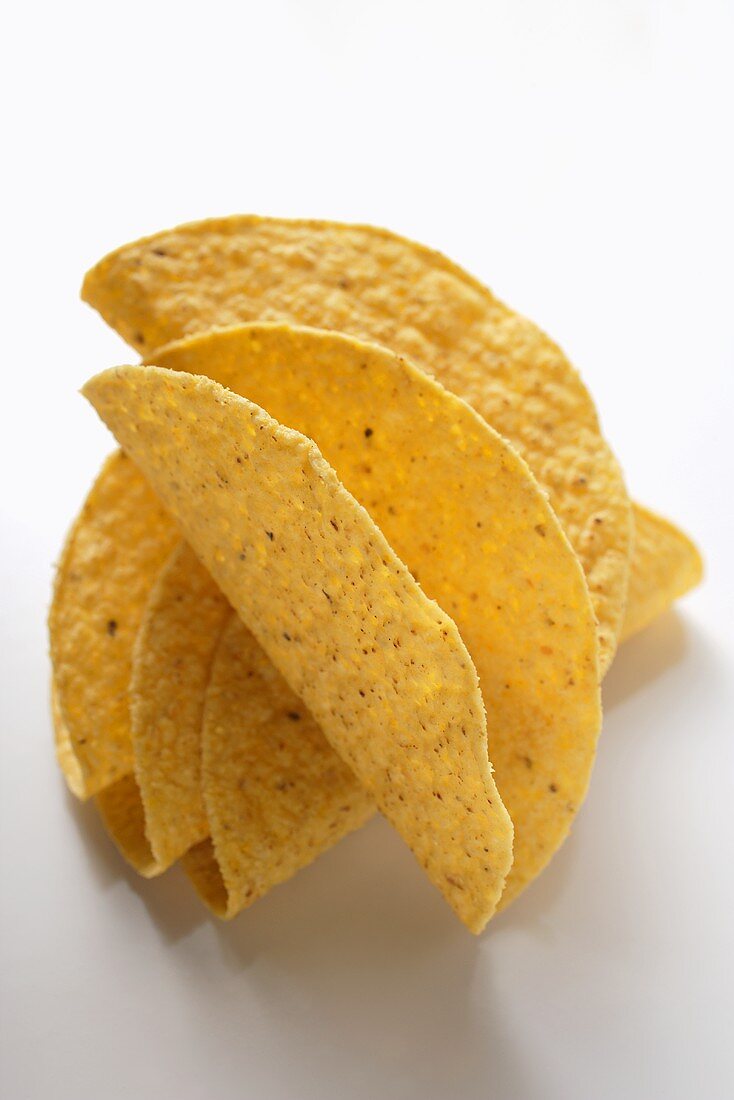 Taco shells on white background