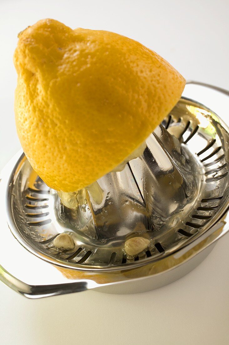 Lemon on lemon squeezer