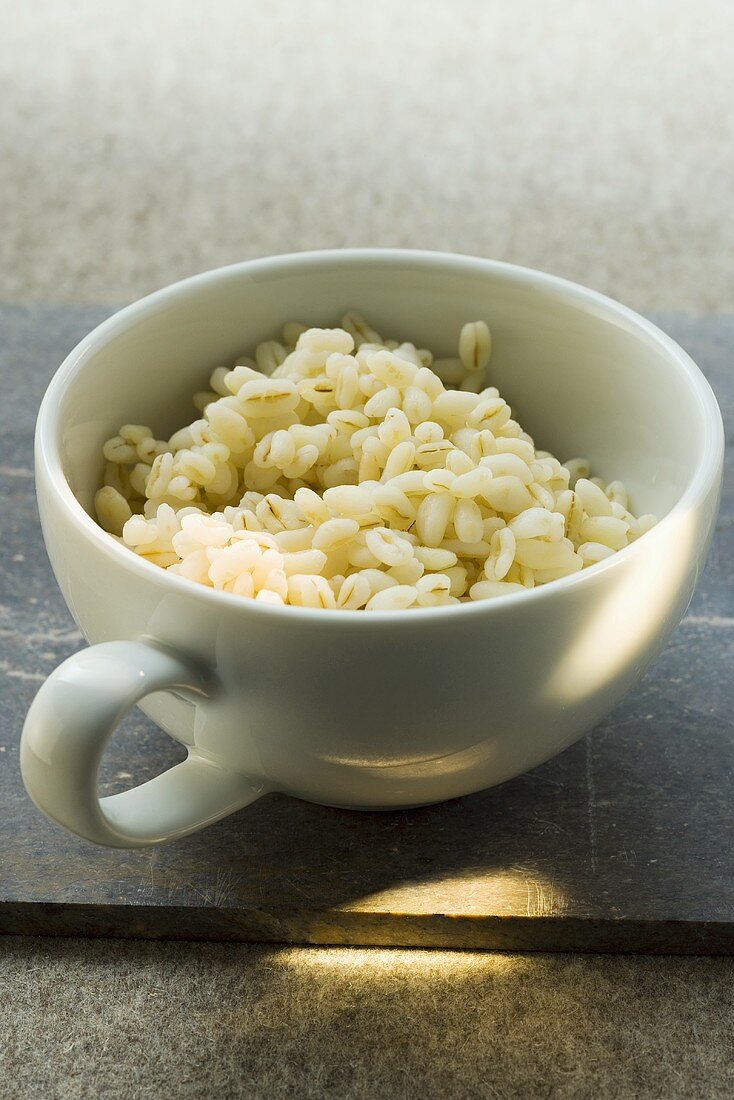 Cooked barley in cup