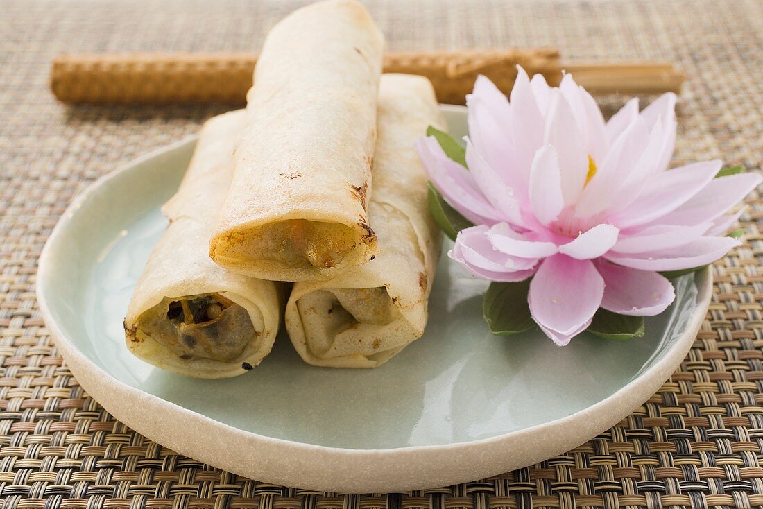Three spring rolls and water lily