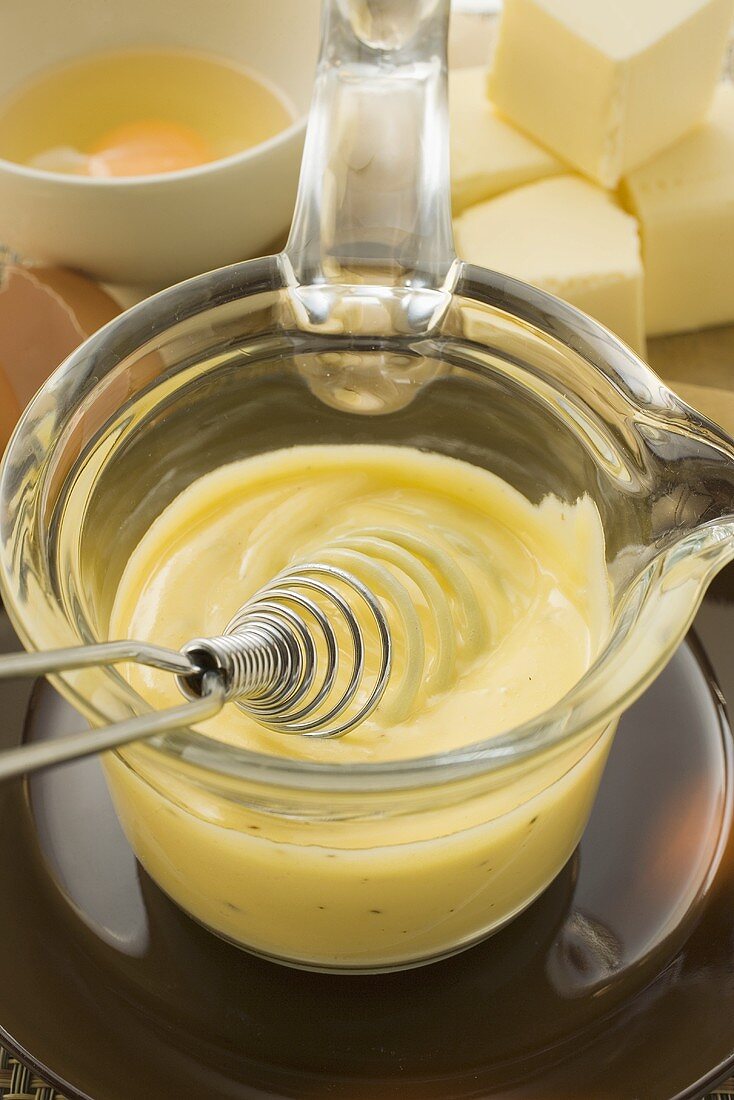 Hollandaise sauce in small glass pan