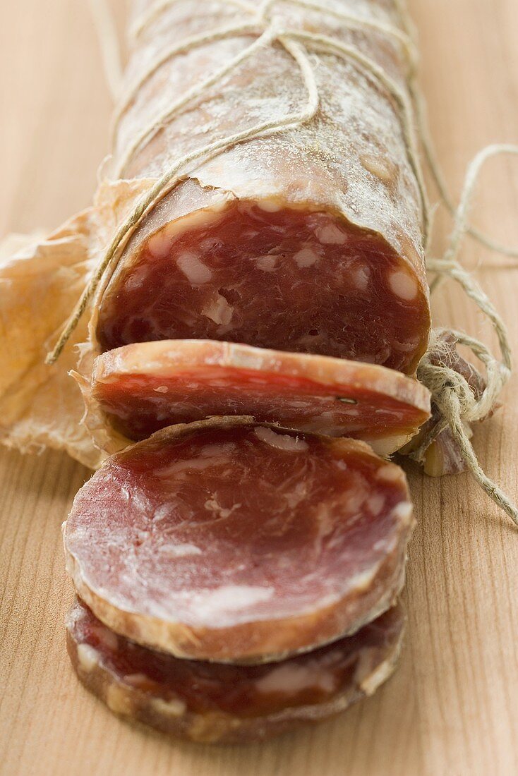 Italian salami with slices cut