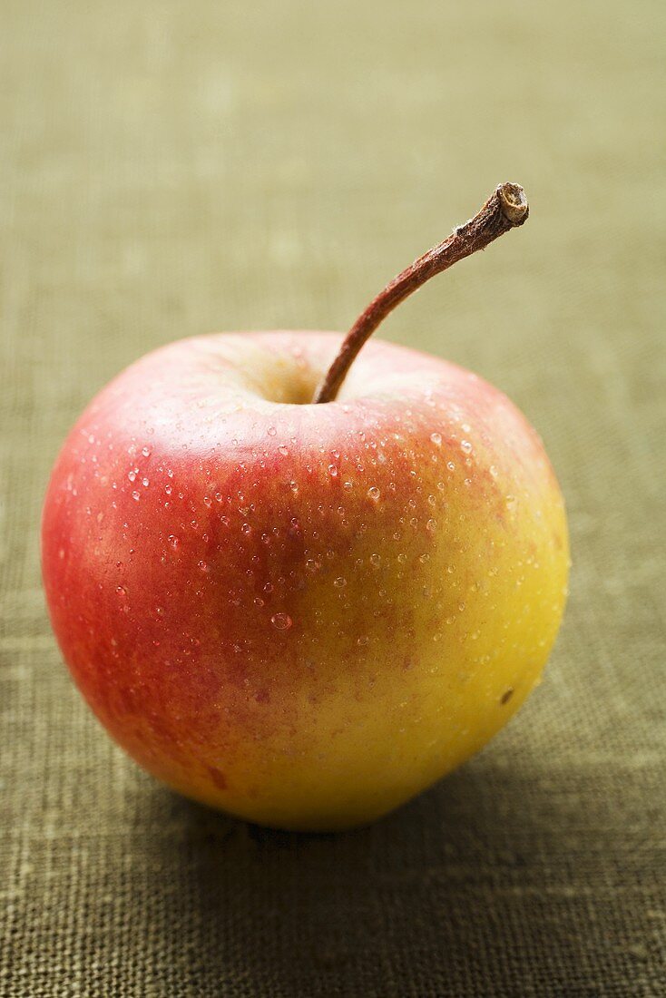 Fresh apple with drops of water