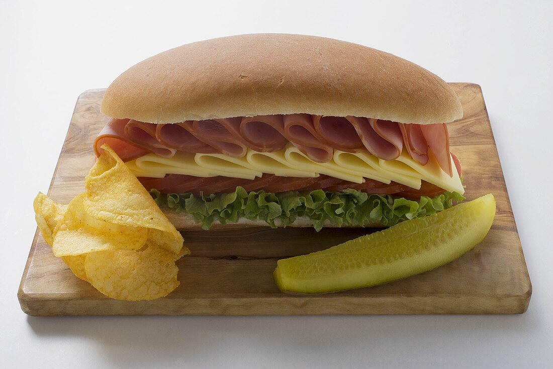 Sub sandwich with crisps and gherkin