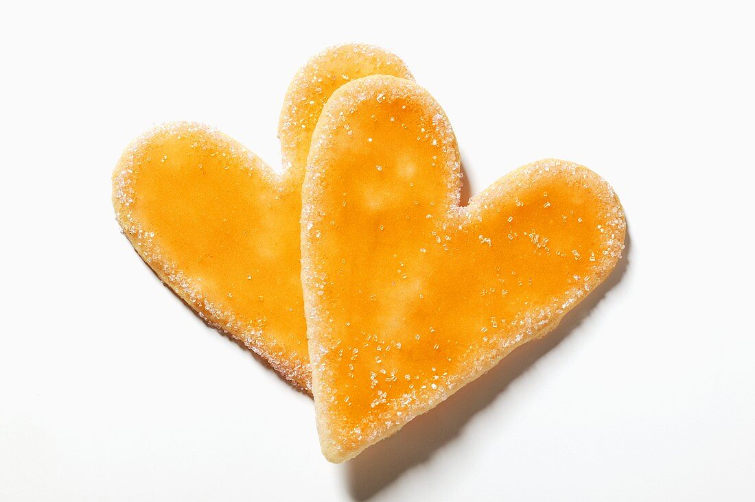 Two glazed and sugared heart-shaped biscuits