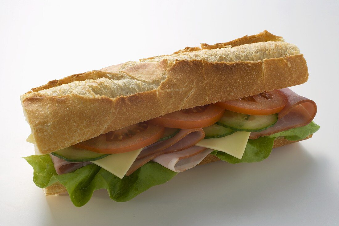 Baguette with ham, cheese, tomato, cucumber and lettuce