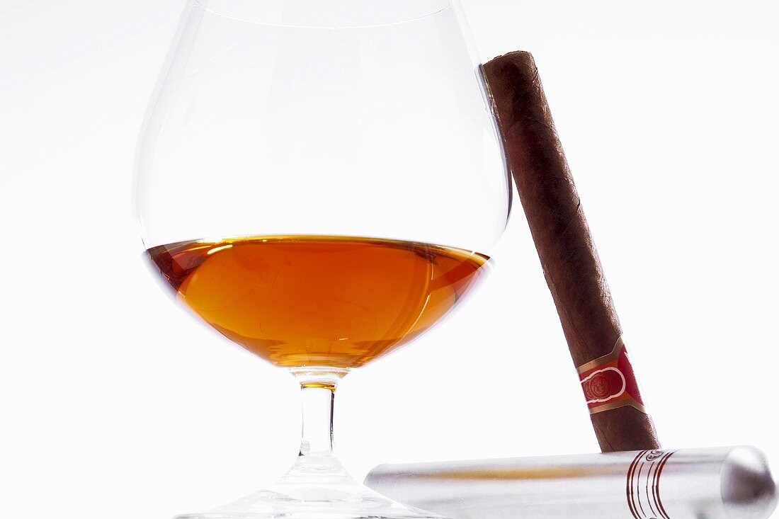 Glass of cognac and cigar