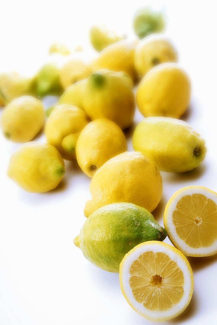 Several lemons, one halved