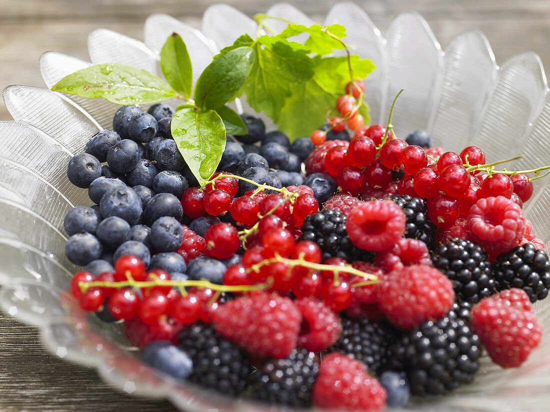Fresh berries in glass bowl