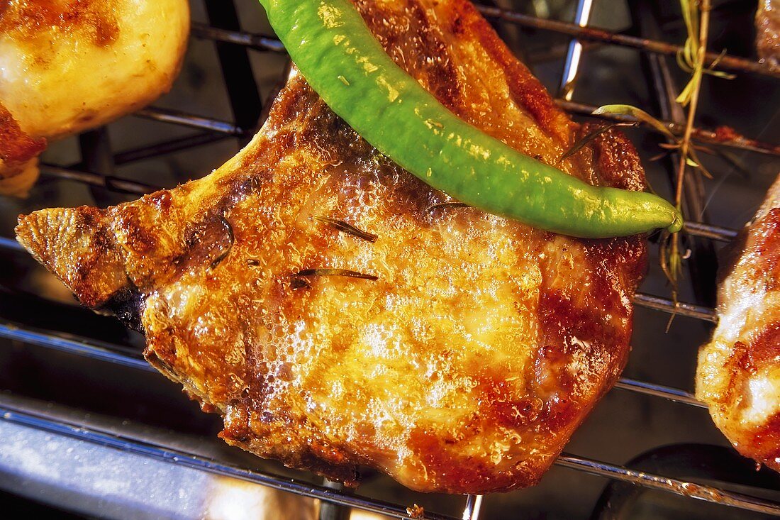 Barbecued pork chop with chili on the barbecue