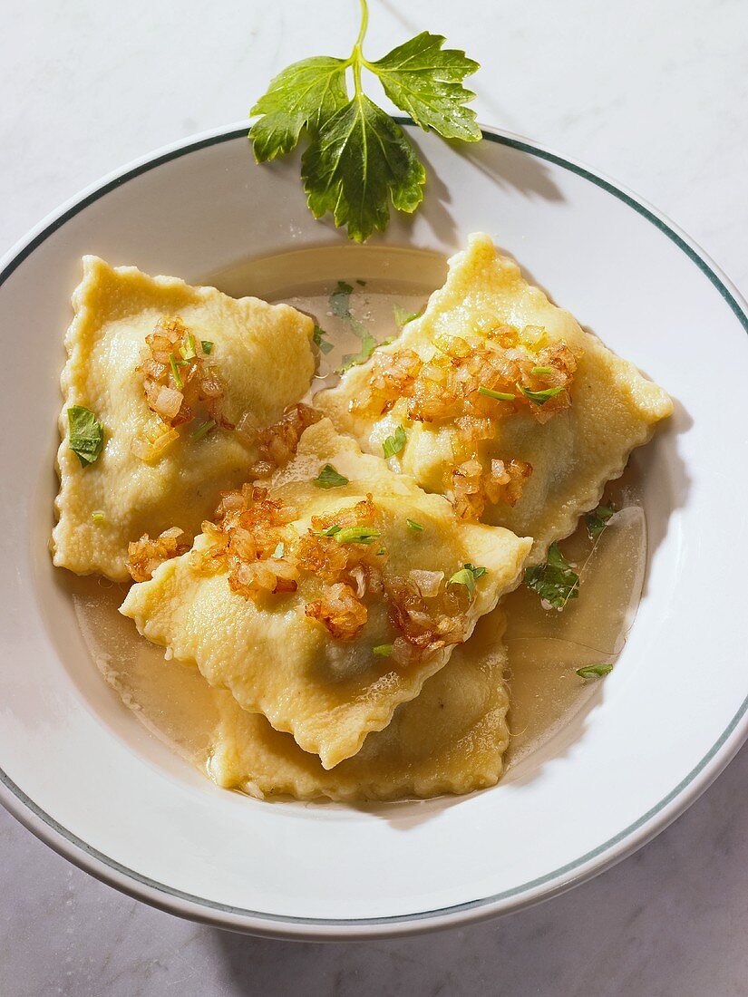 Pasta envelopes with onions and parsley