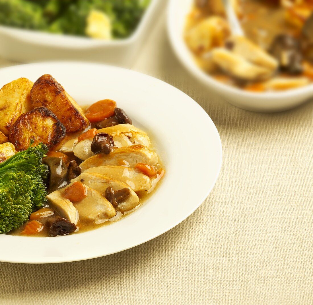Chicken breast in cep sauce with roast potatoes