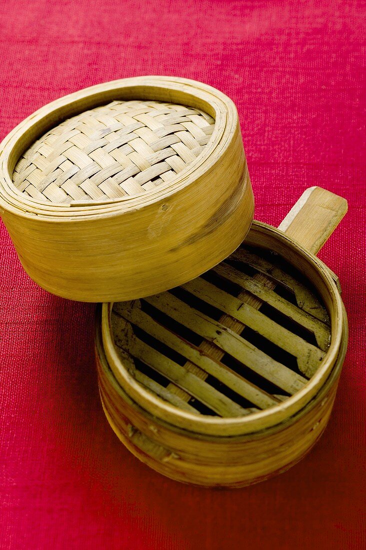Bamboo steamer on red background