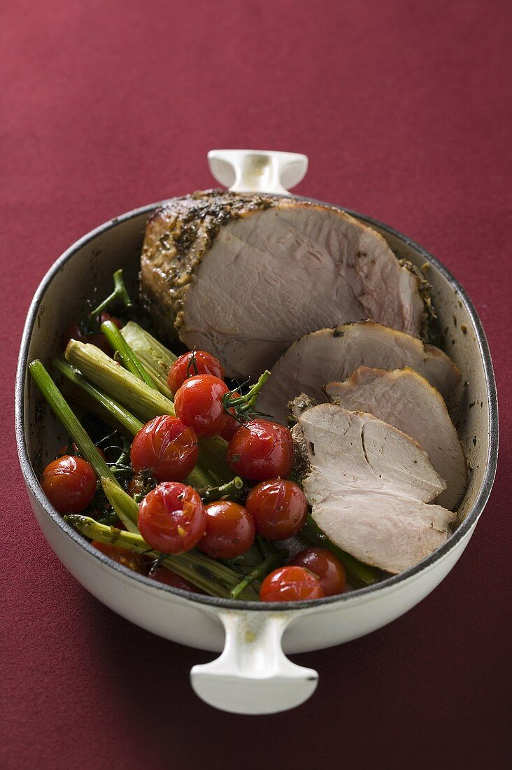Roast pork with cherry tomatoes and celery