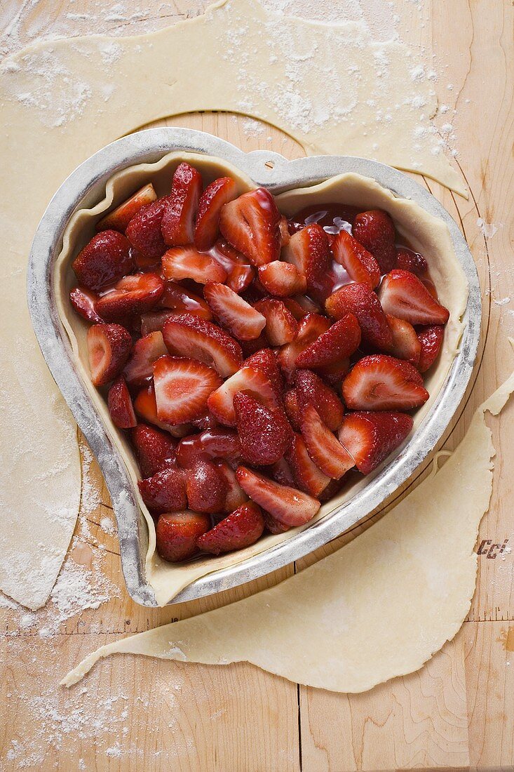 Heart-shaped strawberry pie, unbaked