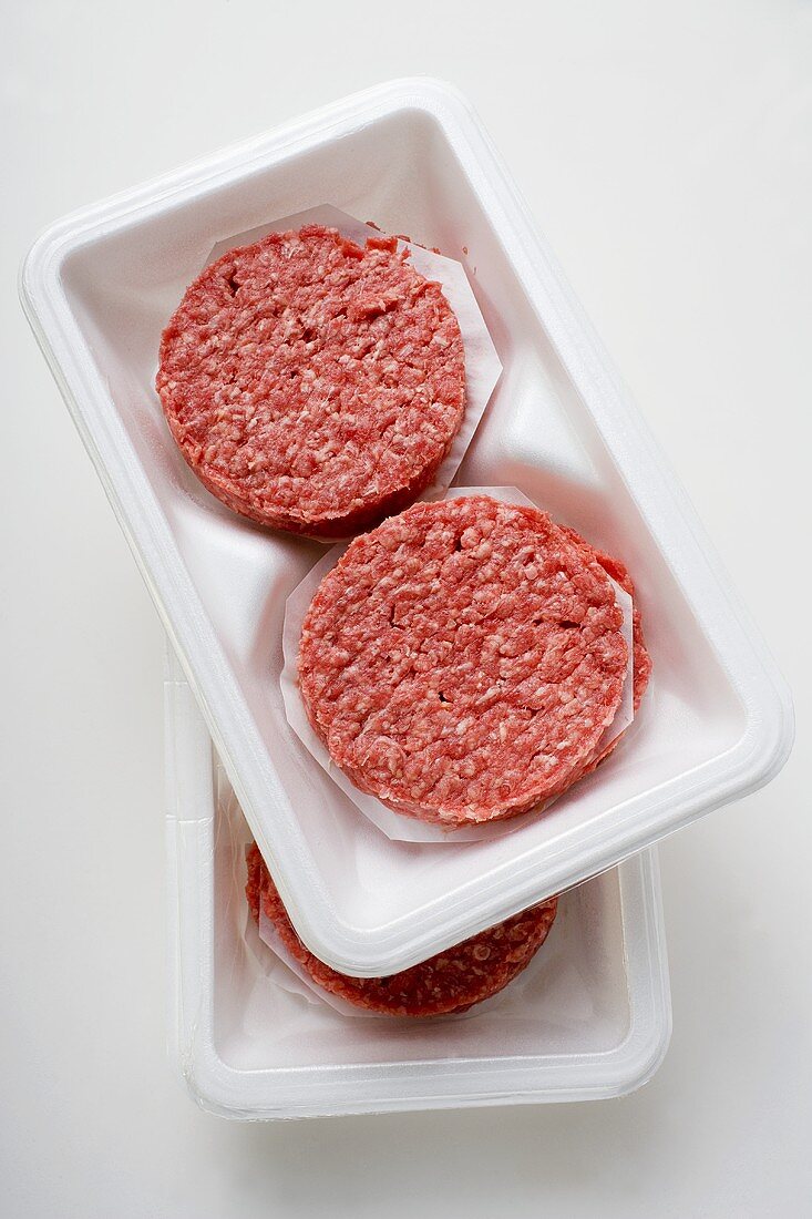 Raw burgers for hamburgers in packaging