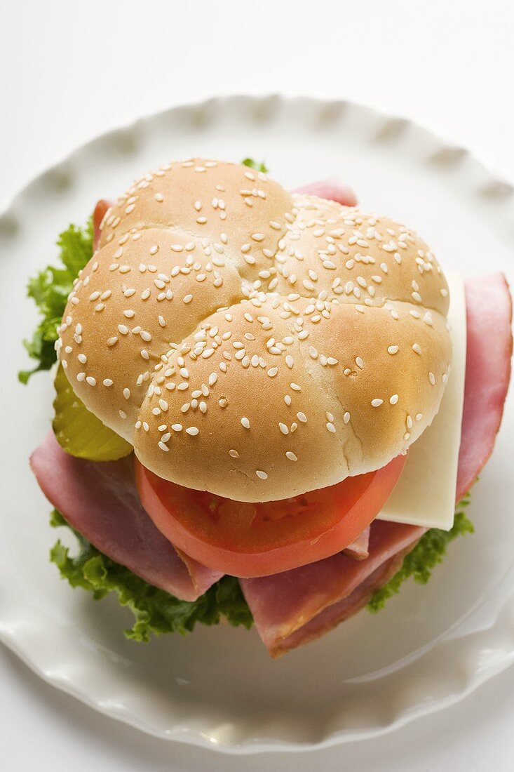 Ham, cheese, tomato and gherkin in sesame roll