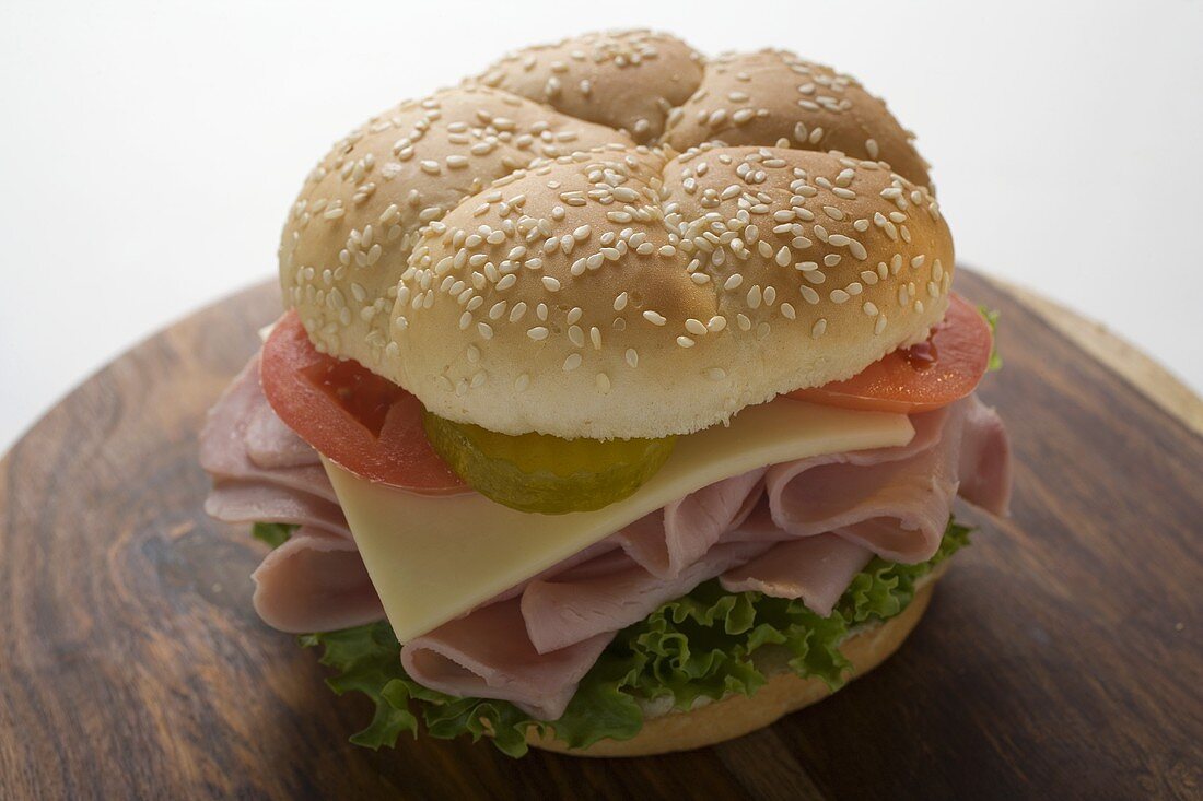 Ham, cheese, tomato and gherkin in sesame roll