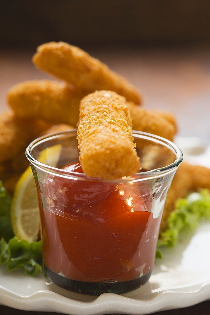 Fish finger with ketchup