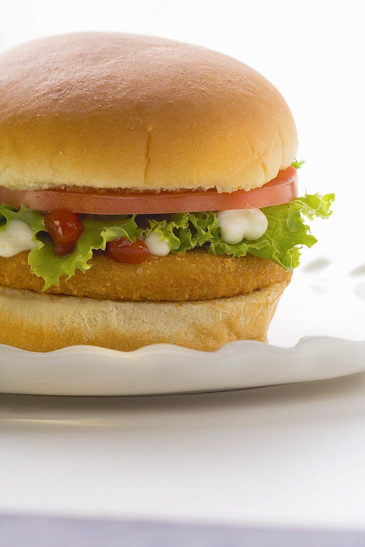 Chicken burger with tomato, lettuce, mayonnaise & ketchup