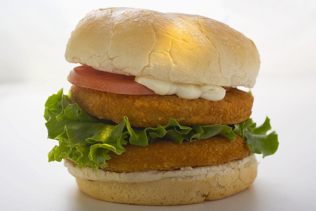 Double chicken burger with tomato, mayonnaise and lettuce