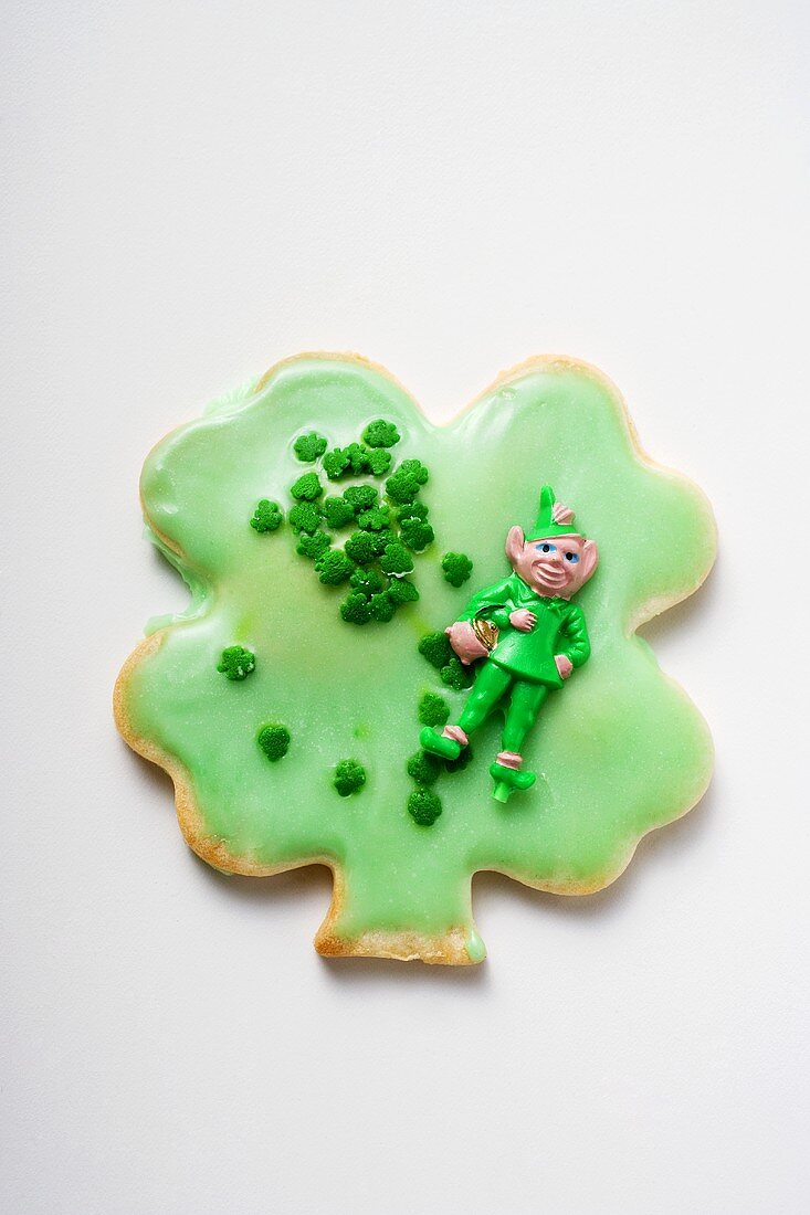 Shamrock biscuit with green icing for St. Patrick's Day