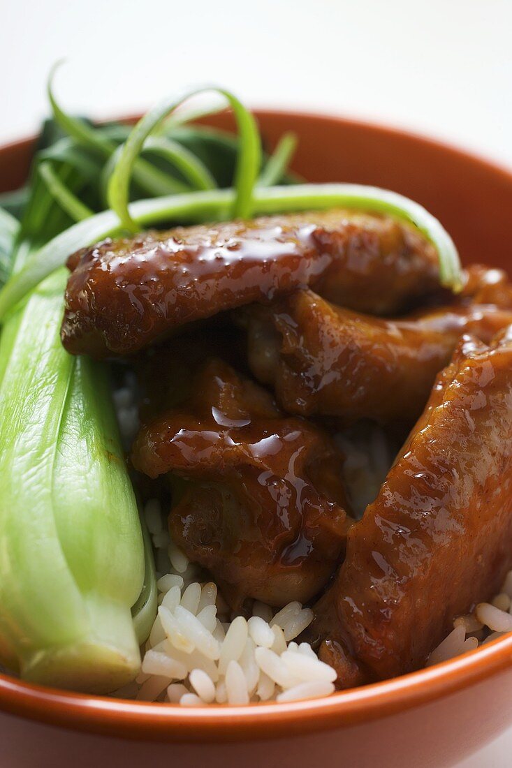 Chicken wings with rice and pak choi
