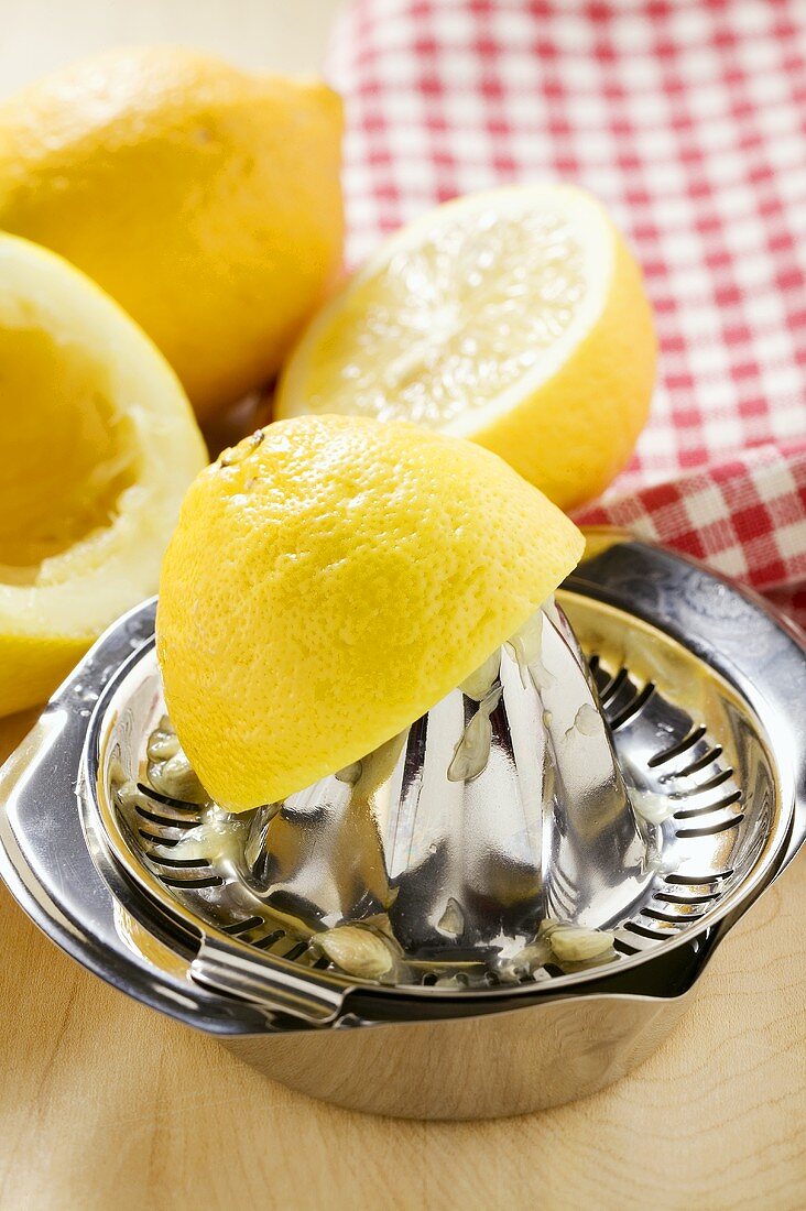 Lemons with lemon squeezer