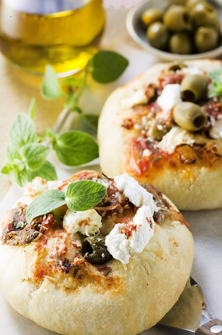 Mini-pizzas with olives and cheese (Sicily)