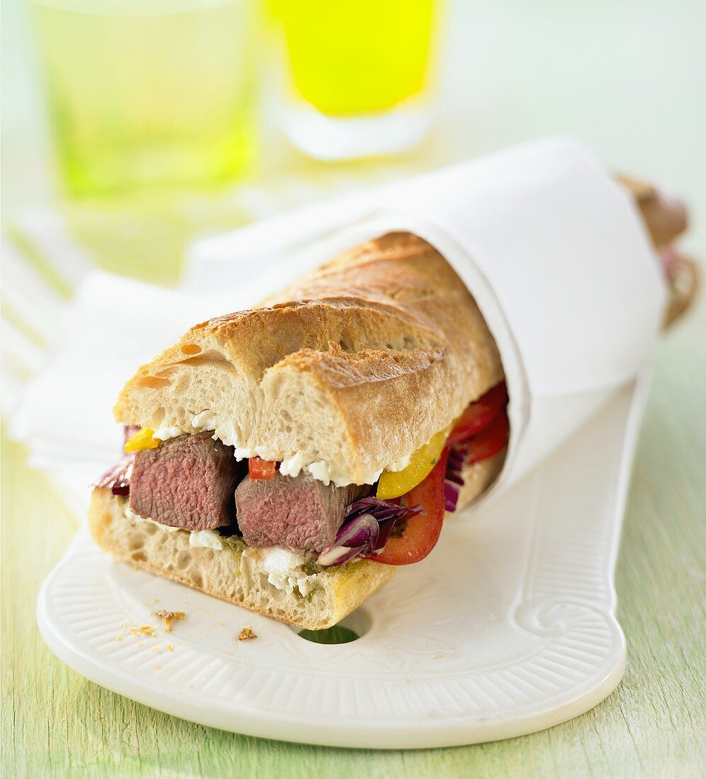 Meat and vegetables in baguette