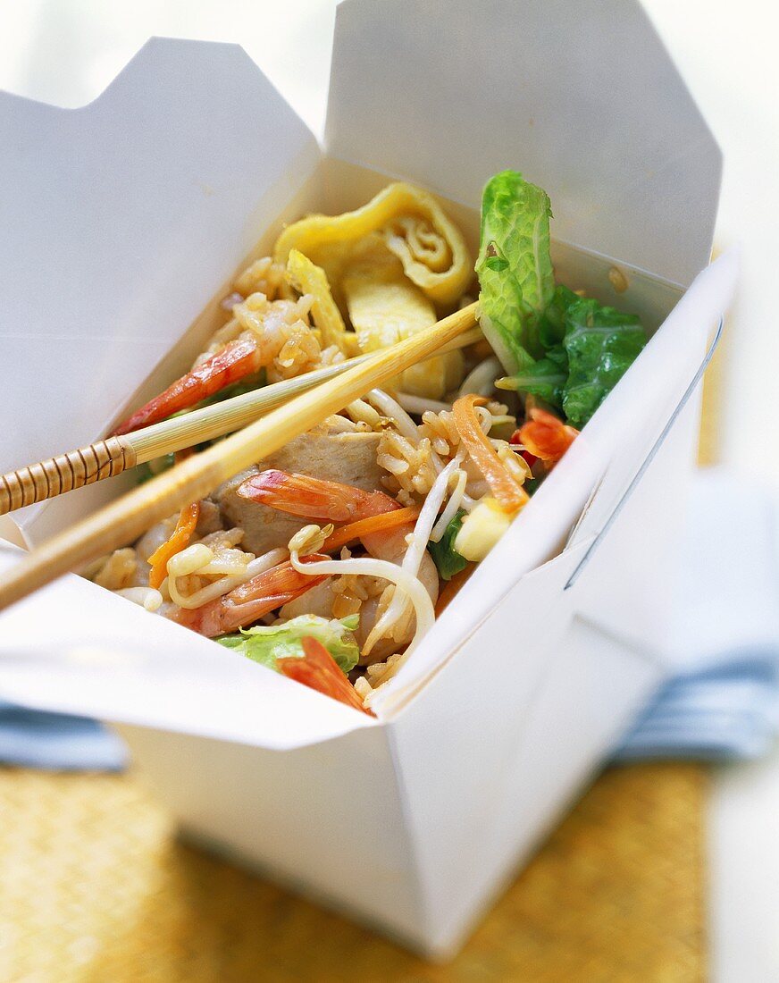 Nasi goreng with chicken, shrimps, pancake strips,take-away box