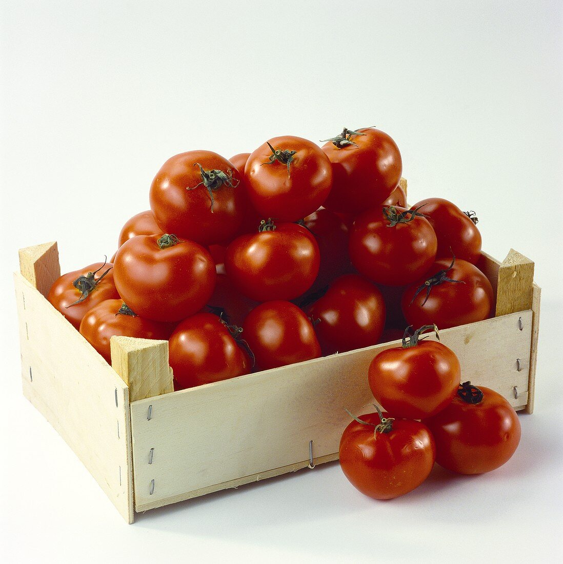 Wooden crate of tomatoes