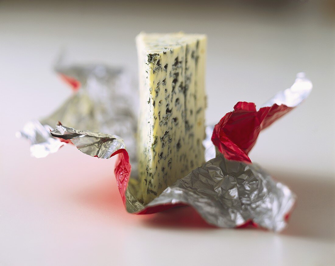 A piece of Roquefort on plastic packaging