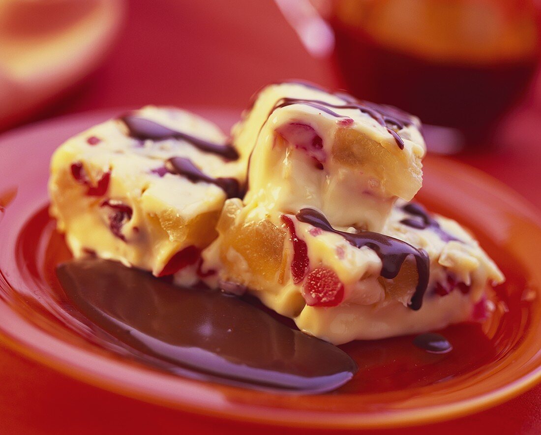 Vanilla pudding with fruit and chocolate sauce