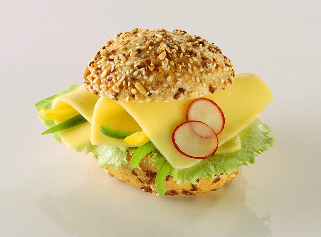 Roll with cheese, peppers, radishes and lettuce leaf