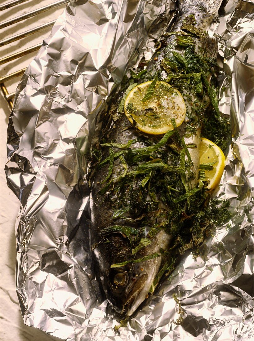Trout with herbs in aluminium foil